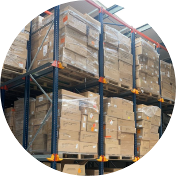 boxes of customer returned clothing stacked in a warehouse ready for recycling